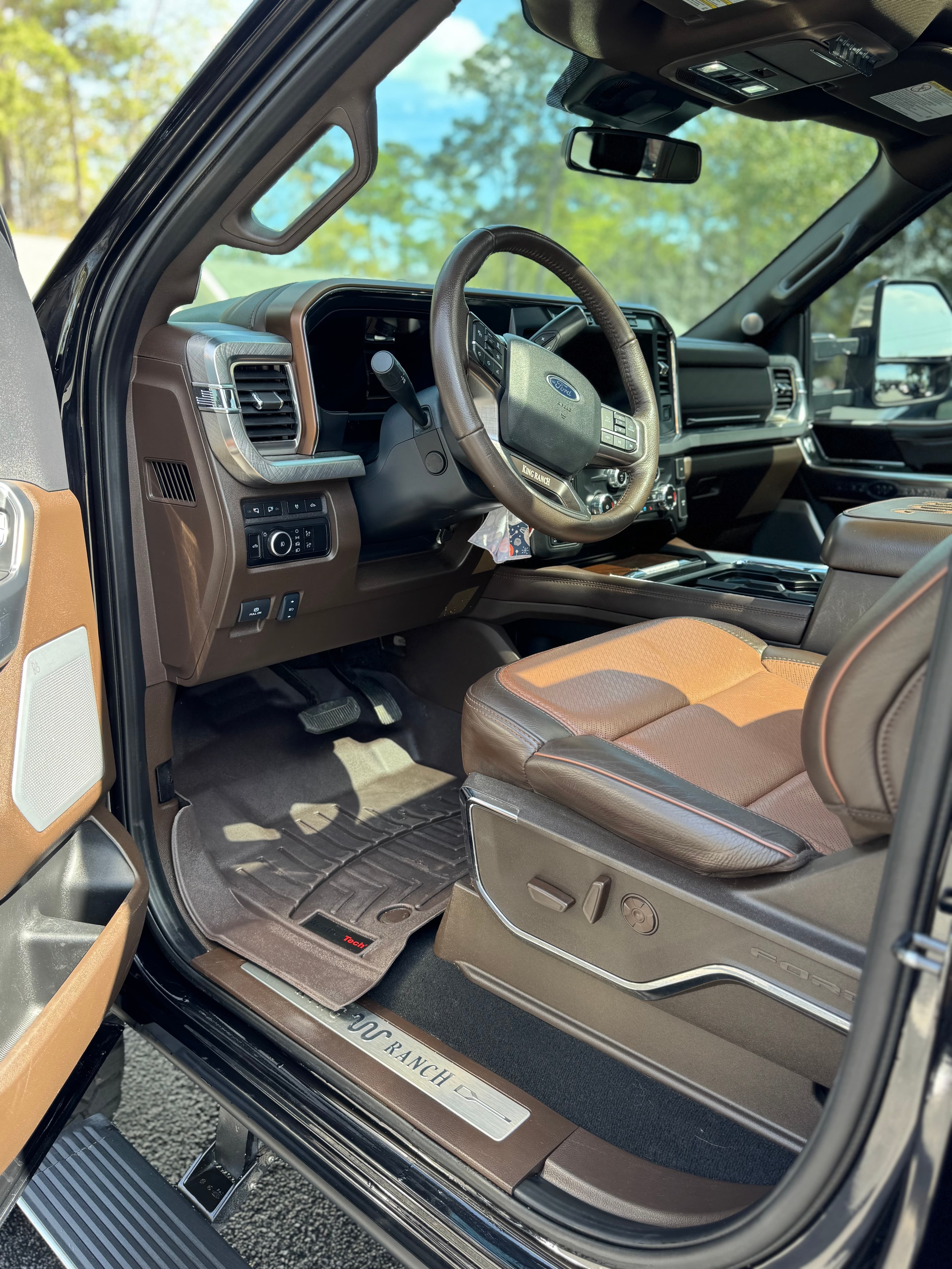 Clean King Ranch leather interior with steering wheel and front seats after detailing